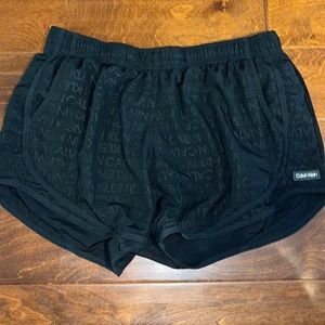 Large, all black, Calvin Klein woman’s athletic shorts